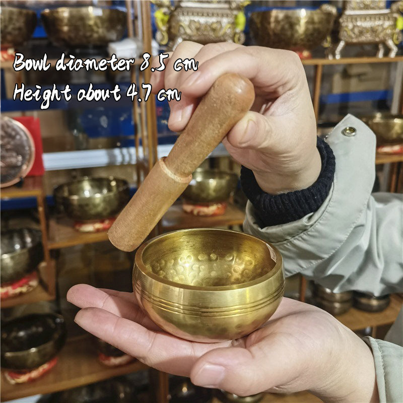 Tibetan brass singing bowl with Sanskrit – handmade meditation instrument for stress relief.
